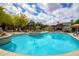 Stunning pool with tiled accents, desert plants, and ample lounge seating at 20750 N 87Th St # 2115, Scottsdale, AZ 85255