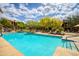 Well-maintained community pool with outdoor seating, desert flora, and sunny skies at 20750 N 87Th St # 2115, Scottsdale, AZ 85255