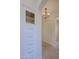 Hallway with white built in cabinet and hanging light fixture at 20750 N 87Th St # 2115, Scottsdale, AZ 85255