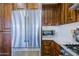 Gourmet kitchen featuring stainless steel appliances, wooden cabinets, and pristine countertops at 20750 N 87Th St # 2115, Scottsdale, AZ 85255
