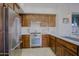 Modern kitchen with ample counter space, stainless steel appliances, and rich wood cabinetry at 20750 N 87Th St # 2115, Scottsdale, AZ 85255