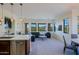 Bright living space with an open layout, featuring a modern kitchen, comfortable seating, and lots of natural light at 20750 N 87Th St # 2115, Scottsdale, AZ 85255