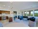 Spacious living area with a modern kitchen, dining area, comfortable seating, and fireplace at 20750 N 87Th St # 2115, Scottsdale, AZ 85255