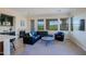 Comfortable living area with fireplace, view windows, wet bar, and modern furnishings at 20750 N 87Th St # 2115, Scottsdale, AZ 85255