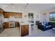 Inviting open-concept living space featuring a cozy fireplace, kitchen island, and comfortable seating area at 20750 N 87Th St # 2115, Scottsdale, AZ 85255