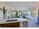 Spacious open-concept living area with a modern kitchen, comfortable seating, and plenty of natural light at 20750 N 87Th St # 2115, Scottsdale, AZ 85255