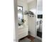 Modern bathroom features white vanity, sleek black fixtures, open shelving, and walk-in shower at 2150 E Bell Rd # 1068, Phoenix, AZ 85022