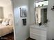 Sleek bathroom with modern vanity, stylish mirror, and view to comfortable bedroom at 2150 E Bell Rd # 1068, Phoenix, AZ 85022