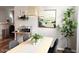 Dining area features a modern light fixture and table, complemented by a plant and minimalist decor at 2150 E Bell Rd # 1068, Phoenix, AZ 85022