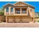 Charming three-story home boasting a private balcony above three garages with stone accents at 2150 E Bell Rd # 1068, Phoenix, AZ 85022
