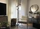 Living room with modern decor, comfortable chair, and large windows at 2150 E Bell Rd # 1068, Phoenix, AZ 85022