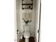 Cozy powder room with decorative artwork and a simple white toilet at 2150 E Bell Rd # 1068, Phoenix, AZ 85022