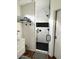 Contemporary bathroom with an open walk-in shower featuring sleek black fixtures and tiled walls at 2150 E Bell Rd # 1068, Phoenix, AZ 85022