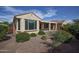 Charming backyard featuring a covered patio and lush greenery, creating a private outdoor oasis at 21883 N 263Rd Dr, Buckeye, AZ 85396