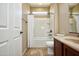 Bright bathroom featuring a shower-tub combo with white tiling and a modern vanity at 21883 N 263Rd Dr, Buckeye, AZ 85396
