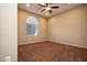 An airy bedroom with a window with blinds and neutral walls at 21883 N 263Rd Dr, Buckeye, AZ 85396
