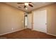 Spacious bedroom features a ceiling fan, plus double closets at 21883 N 263Rd Dr, Buckeye, AZ 85396