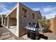 Covered patio with built-in barbecue grill, perfect for outdoor cooking and entertaining in style at 21883 N 263Rd Dr, Buckeye, AZ 85396