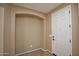 Inviting entryway features neutral tones and a convenient nook, seamlessly blending style with functionality at 21883 N 263Rd Dr, Buckeye, AZ 85396