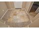 Foyer hallway showcasing attractive tile flooring and access to living spaces at 21883 N 263Rd Dr, Buckeye, AZ 85396