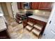 Spacious kitchen features modern appliances, granite counters, and convenient roll-out shelving at 21883 N 263Rd Dr, Buckeye, AZ 85396
