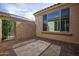 Open patio is constructed from pavers and includes a metal gate at 21883 N 263Rd Dr, Buckeye, AZ 85396