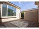 The open patio is constructed from pavers and is partially covered at 21883 N 263Rd Dr, Buckeye, AZ 85396
