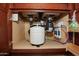 View of plumbing and water filtration system below the sink at 21883 N 263Rd Dr, Buckeye, AZ 85396