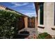 Side yard includes a gate and some plantings at 21883 N 263Rd Dr, Buckeye, AZ 85396
