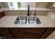 Granite countertop and sink with stainless steel faucet at 21883 N 263Rd Dr, Buckeye, AZ 85396