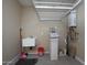 Practical utility room with a sink, water softener, and efficient storage solutions at 21883 N 263Rd Dr, Buckeye, AZ 85396