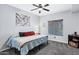 A cozy bedroom with a ceiling fan and large window for natural light, offering a serene retreat at 2201 N Comanche Dr # 1093, Chandler, AZ 85224