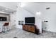 Spacious living room featuring stylish floors, a modern TV cabinet, and an open concept design at 2201 N Comanche Dr # 1093, Chandler, AZ 85224