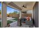 A cozy back patio featuring a fire pit, outdoor seating, and a view of the yard at 22136 N 28Th Pl, Phoenix, AZ 85050