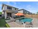 Spacious backyard with a sparkling pool, covered patio area, outdoor kitchen, and a well-maintained lawn at 22136 N 28Th Pl, Phoenix, AZ 85050
