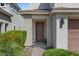 Home's covered entry has a stylish front door and well-maintained landscaping at 22136 N 28Th Pl, Phoenix, AZ 85050
