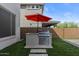 Outdoor grill and cooking space, complete with stainless steel cabinets and prep area, in a well-manicured backyard at 22136 N 28Th Pl, Phoenix, AZ 85050