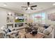 Cozy living room has lots of natural light and custom built-in shelving at 22136 N 28Th Pl, Phoenix, AZ 85050