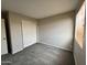Cozy bedroom with neutral walls, carpeted floor, and a window providing natural light at 22311 W Woodlands Ave, Buckeye, AZ 85326