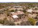 Aerial view shows the surrounding community and natural desert landscape at 23760 N 80Th Way, Scottsdale, AZ 85255
