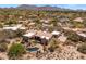 Aerial view of a home featuring a swimming pool, desert landscaping, and mountain views at 23760 N 80Th Way, Scottsdale, AZ 85255