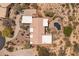 Aerial view of the tile roof of a sprawling home featuring desert landscaping and a pool area at 23760 N 80Th Way, Scottsdale, AZ 85255