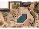 Overhead shot of a backyard pool with brick trim and desert landscaping surrounding the home at 23760 N 80Th Way, Scottsdale, AZ 85255