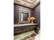 Elegant powder room with designer mirror, unique wallpaper, and stylish vanity with vessel sink at 23760 N 80Th Way, Scottsdale, AZ 85255