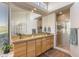 Bathroom featuring a long vanity, large mirror and glass enclosed tiled shower at 23760 N 80Th Way, Scottsdale, AZ 85255