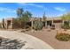Beautiful desert home with gravel landscaping, cacti, and a circular driveway at 23760 N 80Th Way, Scottsdale, AZ 85255