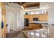Spacious kitchen with granite counters, tiled floors, wooden cabinetry, and modern stainless steel appliances at 23760 N 80Th Way, Scottsdale, AZ 85255