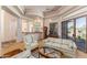 Elegant living room with tray ceilings, large windows, and seamless access to the backyard at 23760 N 80Th Way, Scottsdale, AZ 85255