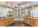 Tranquil main bathroom with corner tub, dual vanities, and abundant natural light from large windows at 23760 N 80Th Way, Scottsdale, AZ 85255