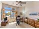 Comfortable home office with built-in storage, a desk, and a large window offering an open view of the neighborhood at 23760 N 80Th Way, Scottsdale, AZ 85255